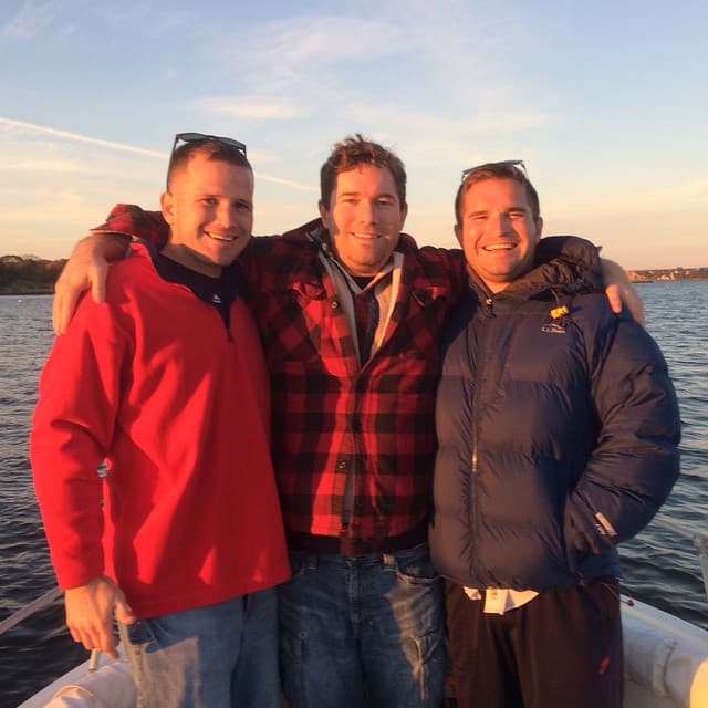 The three Long brothers together on a boat