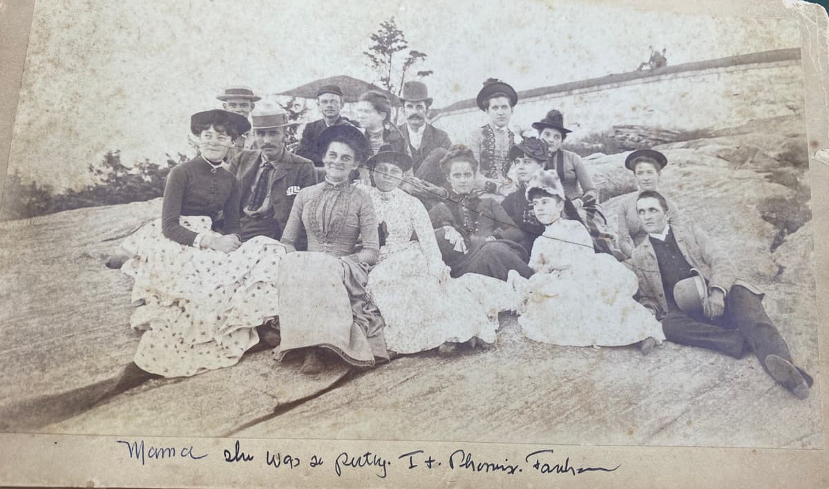Large group on rocks at shore