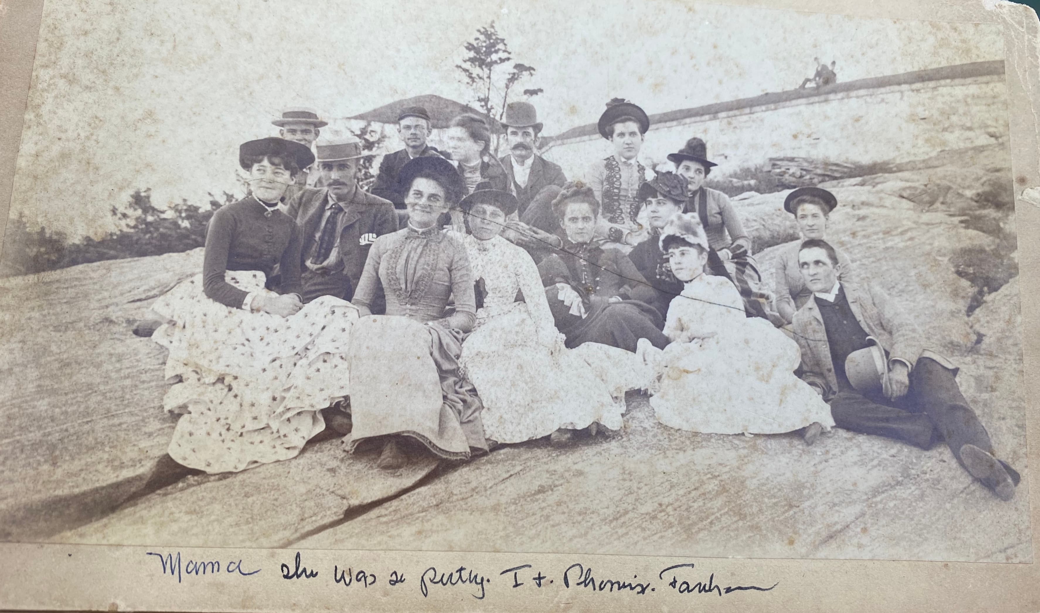 Large group on rocks at shore