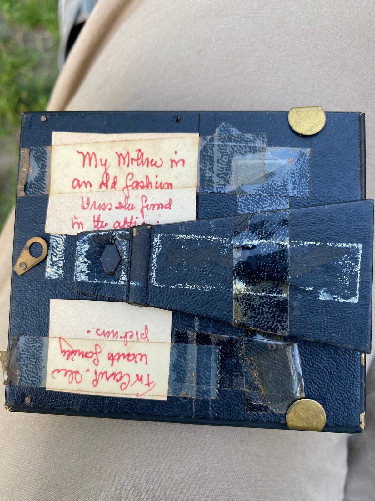 Red-ink label on the back of the attic-dress portrait